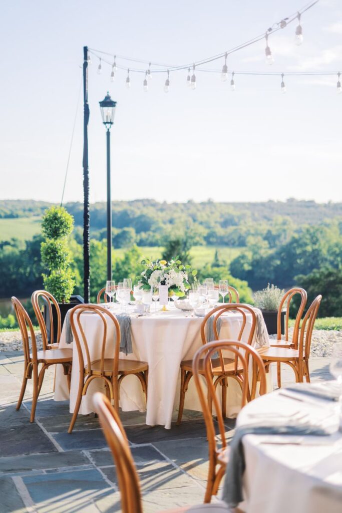 Intimate round table reception setting with garden florals and soft neutral linens—chic and timeless design for a Virginia wedding